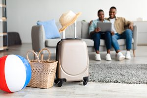 Couple on laptop booking their favorite Lavallette vacation rentals